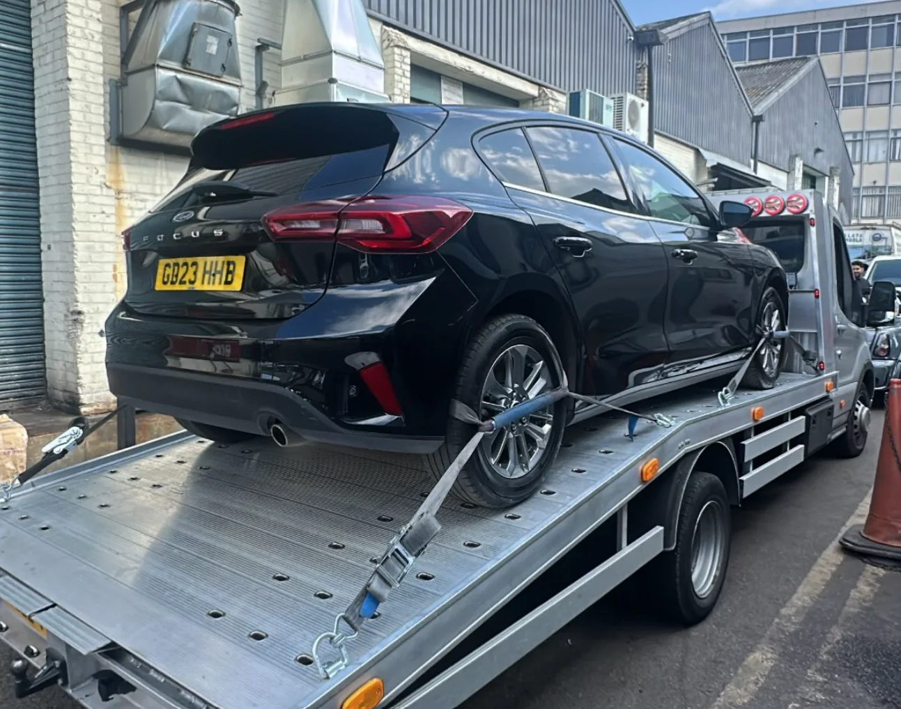 Ford Focus secured on recovery truck